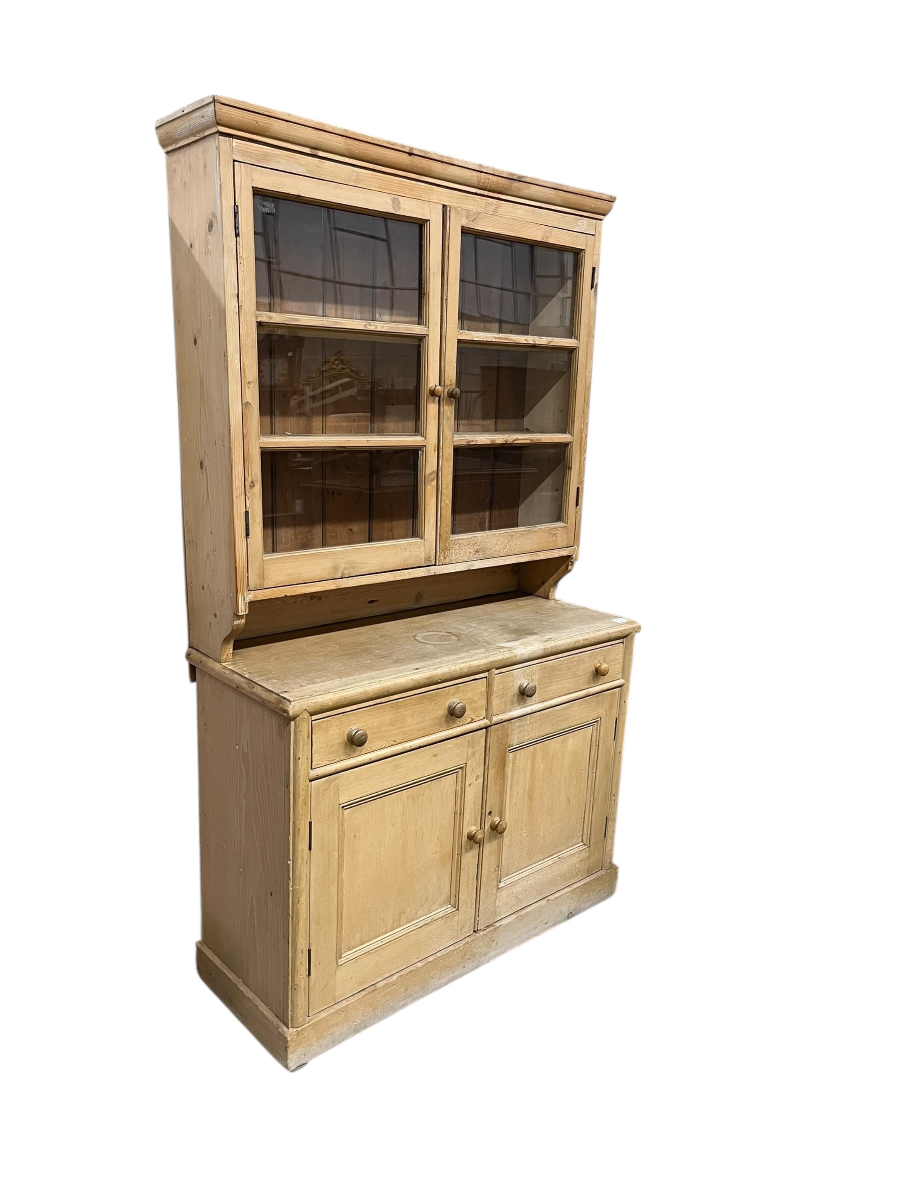 A Victorian pine dresser with glazed upper section, width 110cm, depth 43cm, height 190cm
